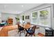 Inviting dining area with natural light, a wooden table, and comfortable seating at 314 Sunnywood Ln, Charlotte, NC 28270