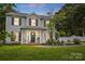 Charming two-story home featuring a welcoming front porch and well-maintained landscaping at 314 Sunnywood Ln, Charlotte, NC 28270