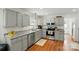 Modern kitchen with stainless steel appliances, granite countertops, and ample cabinet space at 314 Sunnywood Ln, Charlotte, NC 28270