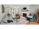 Cozy living room featuring a fireplace, hardwood floors, and comfortable seating at 314 Sunnywood Ln, Charlotte, NC 28270
