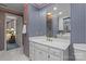Bathroom featuring a large mirror over a sink vanity, a window, and a tiled floor at 3209 Sedgefield Rd, Statesville, NC 28625