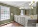 Bathroom featuring a double vanity, tiled floors, and a large window at 3209 Sedgefield Rd, Statesville, NC 28625