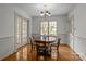 Classic dining room with hardwood floors, ample natural light, and traditional-style furniture at 3209 Sedgefield Rd, Statesville, NC 28625