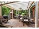 Covered brick patio with outdoor seating, a fireplace, a grill, and manicured landscaping at 3209 Sedgefield Rd, Statesville, NC 28625