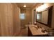 Well-lit bathroom with vanity, medicine cabinet, and tiled floor, offering practical elegance at 344 Lucas Rd, Star, NC 27356
