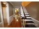 Hallway with hardwood floors and stairs, creating a welcoming entrance to the home at 344 Lucas Rd, Star, NC 27356