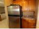 Efficient kitchen space with stainless steel refrigerator and functional cabinetry at 344 Lucas Rd, Star, NC 27356