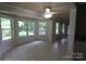 Bright sunroom with multiple windows and tile floors, perfect for relaxation and enjoying natural light at 344 Lucas Rd, Star, NC 27356