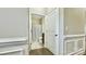 Hallway view into a bathroom with tiled floors and a shower-tub combo at 3735 Norman View Dr, Sherrills Ford, NC 28673