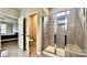 This bathroom features a glass enclosed shower, granite countertops, and tile flooring at 3735 Norman View Dr, Sherrills Ford, NC 28673