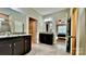 This bathroom features granite countertops, dark wood cabinetry and access to a walk in closet at 3735 Norman View Dr, Sherrills Ford, NC 28673