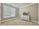 Neutral bedroom with a dresser and a bright window at 3735 Norman View Dr, Sherrills Ford, NC 28673