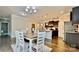 Open dining area next to a kitchen with hardwood floors and natural lighting at 3735 Norman View Dr, Sherrills Ford, NC 28673