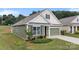Charming single-story home with a green exterior, complemented by a well-manicured lawn and attached garage at 3735 Norman View Dr, Sherrills Ford, NC 28673