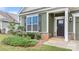 Inviting home entrance featuring a dark front door, shuttered windows, and fresh landscaping at 3735 Norman View Dr, Sherrills Ford, NC 28673