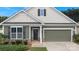 Inviting home entrance featuring a dark front door, shuttered windows, and attached garage at 3735 Norman View Dr, Sherrills Ford, NC 28673