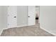 Bedroom doorway with wood floors and neutral walls, leading to other rooms in the home at 4108 Mellon Rd, Matthews, NC 28104
