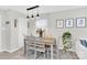 Cozy dining area with modern light fixtures, stylish decor, and a view of the adjacent living space at 4108 Mellon Rd, Matthews, NC 28104