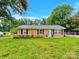 Charming brick home featuring a well-maintained lawn, a welcoming front door, and classic black shutters at 4108 Mellon Rd, Matthews, NC 28104
