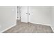 Hallway with wood floors and neutral walls, leading to other rooms in the home at 4108 Mellon Rd, Matthews, NC 28104