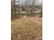 Picturesque backyard leading to lake with lush green grass and mature trees at 4995 Wildlife Ln # 1, Sherrills Ford, NC 28673