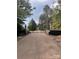 Private driveway with secure gate, mature trees, and manicured landscaping at 4995 Wildlife Ln # 1, Sherrills Ford, NC 28673