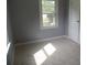 Bedroom featuring carpeted floors, neutral walls, a window, and a closet at 5004 King Wilkinson Rd, Denver, NC 28037