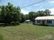Charming single-Gathering home with a metal roof, detached garage, and large yard at 5004 King Wilkinson Rd, Denver, NC 28037