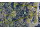 An aerial view of a large wooded lot with outlines of property lines on a residential street at 555 Ridge Ave, Mooresville, NC 28115
