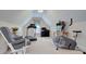 Versatile bonus room with exercise equipment and a cozy seating area at 5748 Timbertop Ln, Charlotte, NC 28215