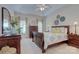Inviting primary bedroom boasts natural light, a trey ceiling, and neutral paint at 5748 Timbertop Ln, Charlotte, NC 28215