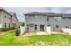 Exterior rear of home featuring patio area, fenced yard, and grass at 5836 Clan Maclaine Dr, Charlotte, NC 28278