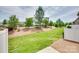 Well-maintained backyard with grass, a privacy fence, and landscaping at 5836 Clan Maclaine Dr, Charlotte, NC 28278