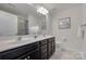 Bright bathroom showcasing double sinks, a large mirror, and modern fixtures at 5836 Clan Maclaine Dr, Charlotte, NC 28278
