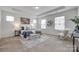 Spacious main bedroom with tray ceilings, neutral decor, and large windows offering plenty of natural light at 5836 Clan Maclaine Dr, Charlotte, NC 28278