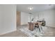 Bright office space featuring a modern desk, large rug, and natural light at 5836 Clan Maclaine Dr, Charlotte, NC 28278