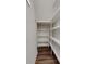 Walk-in pantry features wood-look floors and ample shelving for optimal organization at 5836 Clan Maclaine Dr, Charlotte, NC 28278