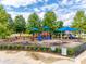 Community playground featuring colorful play structures, swings, and slides for children to enjoy in a safe environment at 5836 Clan Maclaine Dr, Charlotte, NC 28278