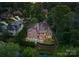 Drone shot overlooking large brick home and its swimming pool, patio, and extensive backyard at 5915 Vidal Ln, Charlotte, NC 28226