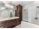 Bright bathroom boasting a glass shower, tile floors, a spacious vanity, and great storage at 5915 Vidal Ln, Charlotte, NC 28226