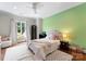 Bright bedroom with a ceiling fan, a window, and a plush rug at 5915 Vidal Ln, Charlotte, NC 28226