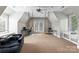 Large bonus room featuring an open floor plan, neutral colors, and unique features for an active lifestyle at 5915 Vidal Ln, Charlotte, NC 28226
