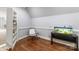 Cozy room featuring a reading nook, built in bookcases, beautiful wood floors, and soft neutral paint at 5915 Vidal Ln, Charlotte, NC 28226