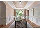 Formal dining room with elegant decor, chandelier lighting, and a large window view at 5915 Vidal Ln, Charlotte, NC 28226