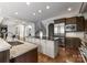 Open kitchen featuring dark wood cabinets and light countertops at 5915 Vidal Ln, Charlotte, NC 28226