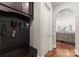 Mudroom featuring a bench, hooks, and cabinetry for easy storage at 5915 Vidal Ln, Charlotte, NC 28226