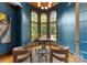 Stylish home office featuring custom wood trim, large windows, and elegant lighting at 5915 Vidal Ln, Charlotte, NC 28226