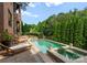 Beautiful backyard featuring a swimming pool, spa, and lounge chairs at 5915 Vidal Ln, Charlotte, NC 28226
