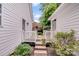 Exterior passageway with connecting deck providing access to a backyard oasis at 592 Woodcrest Dr, Gastonia, NC 28056