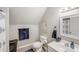Well-lit bathroom featuring a toilet, sink, decorative sign, and modern fixtures at 592 Woodcrest Dr, Gastonia, NC 28056
